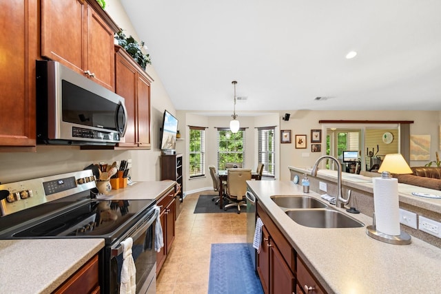 544 Running Deer Trl, Myrtle Beach, SC 29588 - kitchen featuring appliances with stainless steel finishes, a sink, light countertops, light tile patterned floors, and pendant lighting