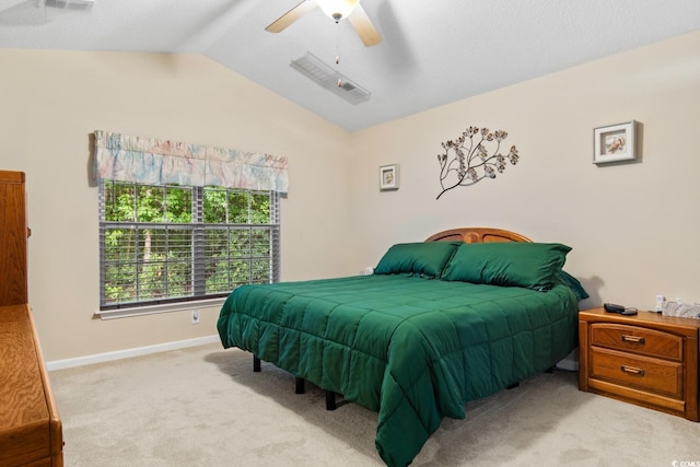 carpeted bedroom featuring lofted ceiling and ceiling fan