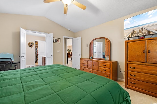 bedroom featuring lofted ceiling, carpet, and ceiling fan