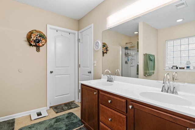 544 Running Deer Trl, Myrtle Beach, SC 29588 - bathroom featuring a stall shower, baseboards, double vanity, and tile patterned flooring