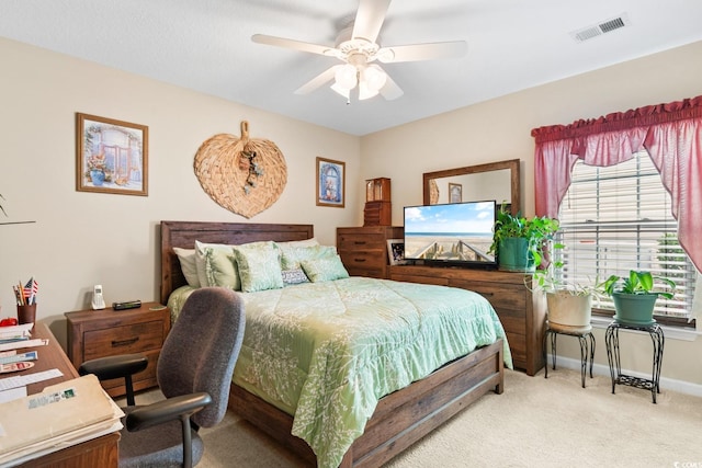 bedroom featuring light carpet and ceiling fan