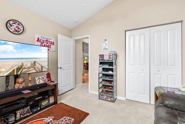 interior space with light carpet and vaulted ceiling