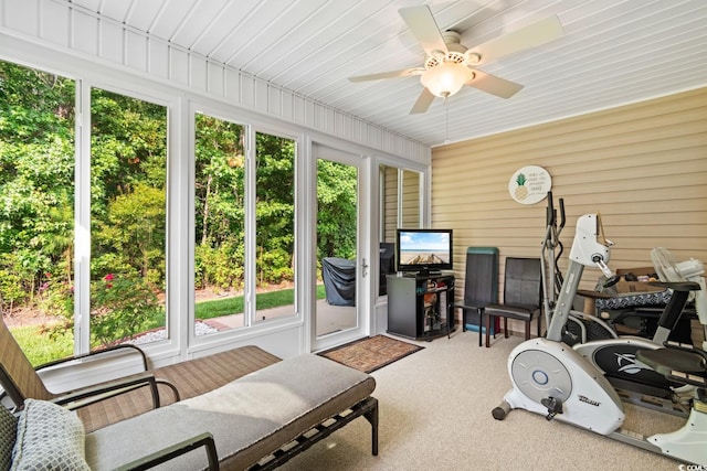 sunroom / solarium featuring ceiling fan