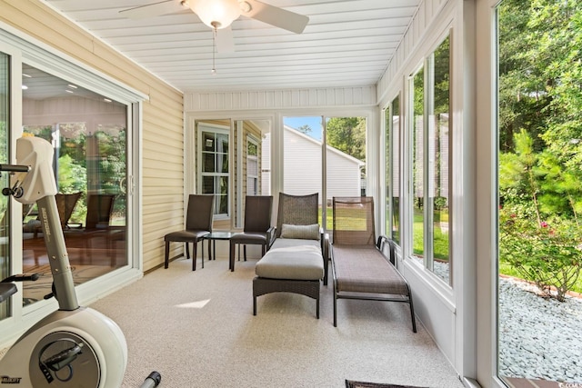 sunroom featuring wooden ceiling and ceiling fan