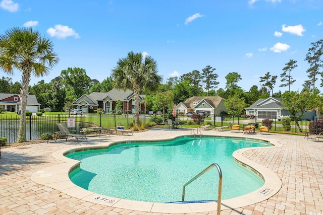 view of swimming pool featuring a patio area