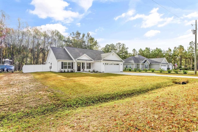 ranch-style house featuring a front lawn and a garage