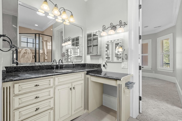 bathroom with crown molding, tile patterned flooring, and vanity