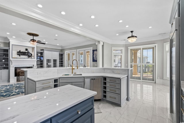 kitchen with sink, stainless steel dishwasher, gray cabinets, light stone countertops, and ornamental molding