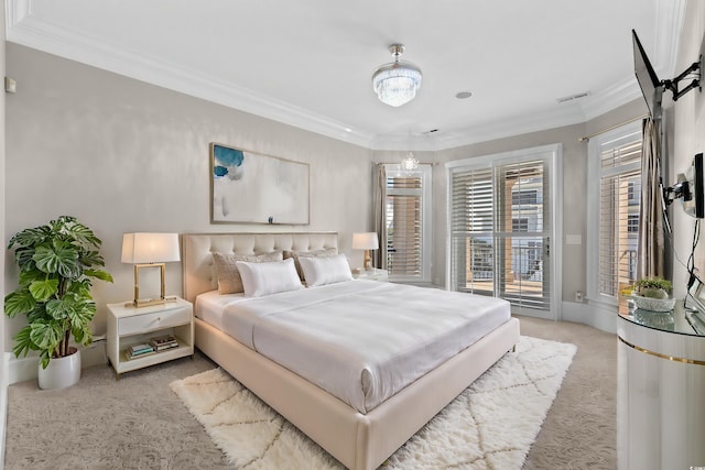 bedroom featuring crown molding, access to exterior, and light carpet