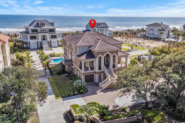 aerial view featuring a water view and a view of the beach