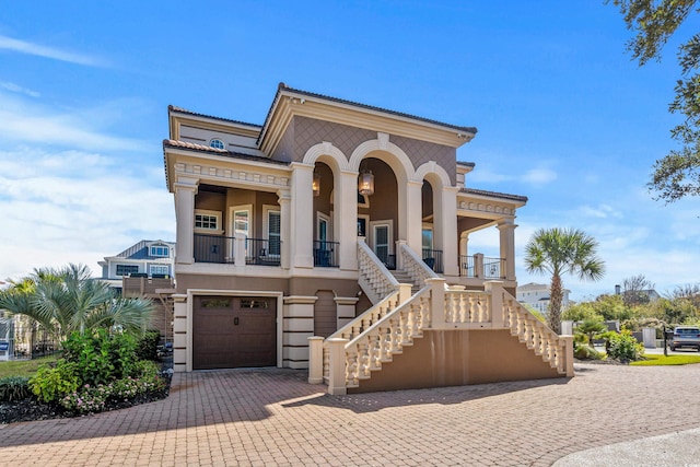 view of front of property featuring covered porch and a garage