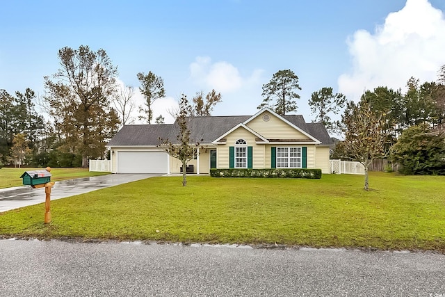 single story home featuring a garage and a front lawn