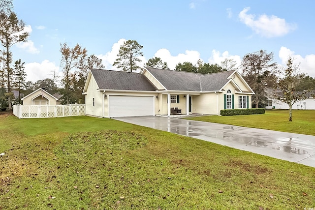 single story home featuring a garage and a front lawn