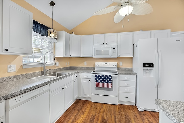 kitchen with dark hardwood / wood-style flooring, sink, white cabinets, white appliances, and lofted ceiling