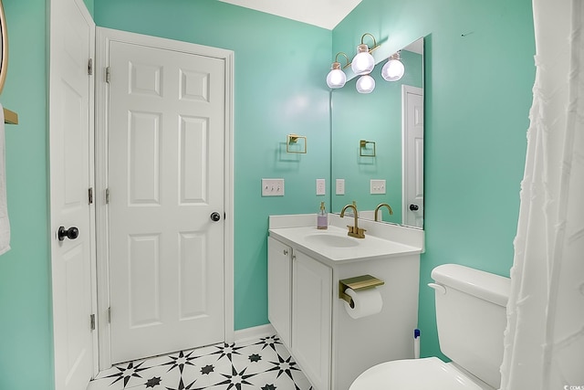 bathroom featuring vanity and toilet