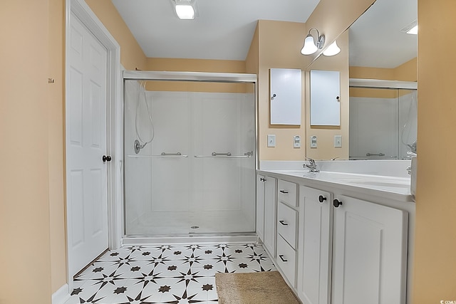 bathroom with a shower with door and vanity