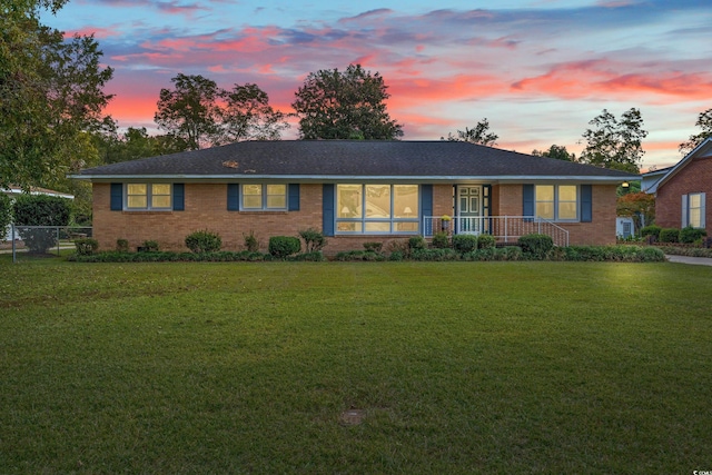 ranch-style house with a yard