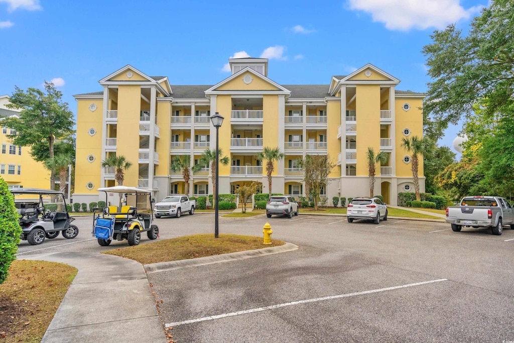 view of property with uncovered parking