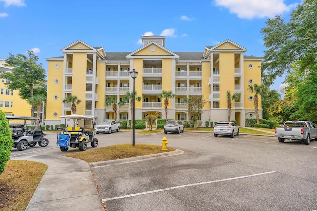 view of property with uncovered parking