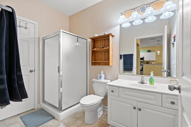 bathroom featuring tile patterned floors, vanity, toilet, and an enclosed shower