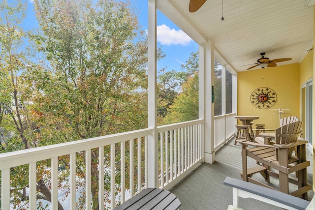 sunroom featuring ceiling fan and plenty of natural light