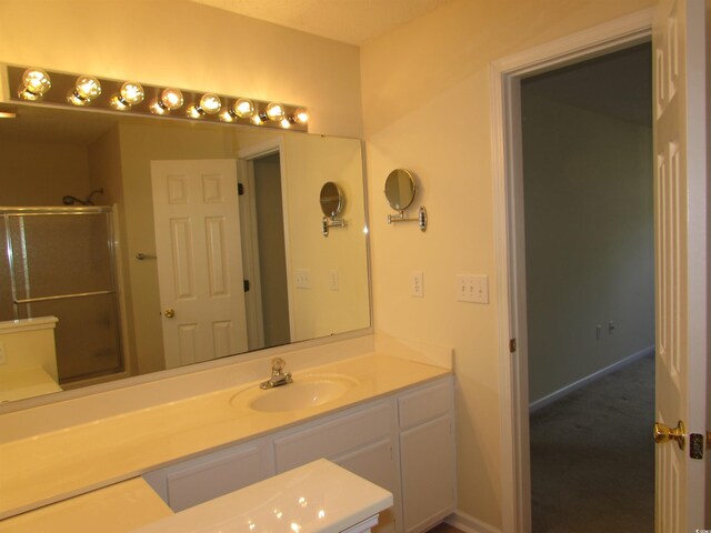 bathroom with vanity and an enclosed shower