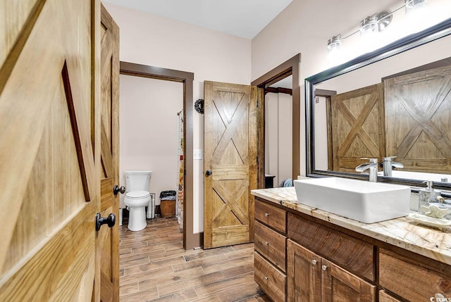 7299 Cartrette Rd, Aynor, SC 29511 - bathroom with vanity, toilet, and wood finished floors