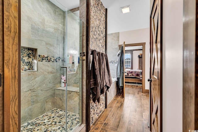 bathroom with a shower with shower door