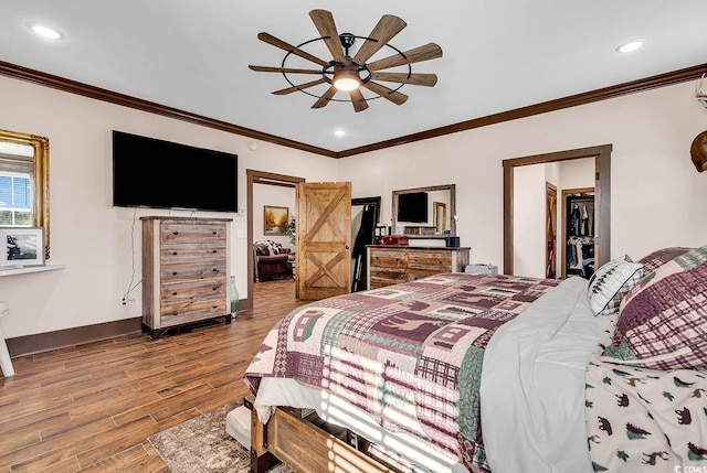 bedroom featuring ceiling fan, ornamental molding, and hardwood / wood-style flooring