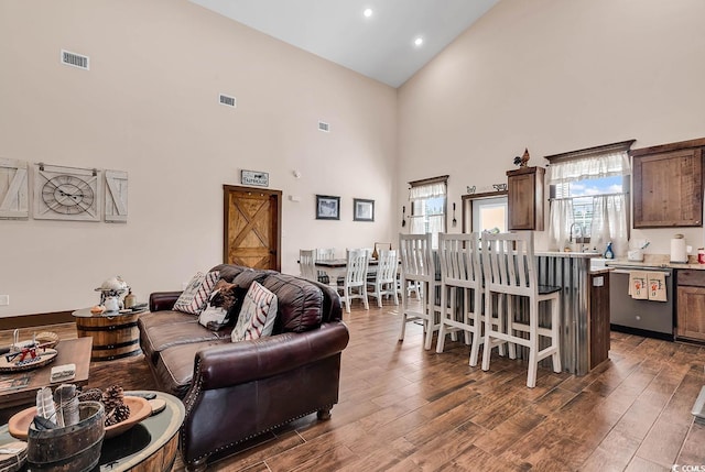 living room with a high ceiling