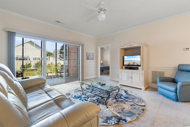 living room with light colored carpet, ceiling fan, and ornamental molding