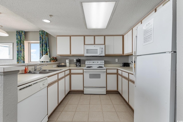 kitchen featuring a textured ceiling, white appliances, sink, and white cabinets