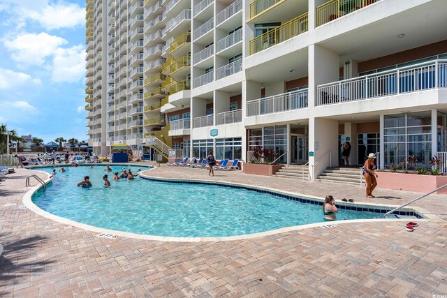 view of swimming pool featuring a patio