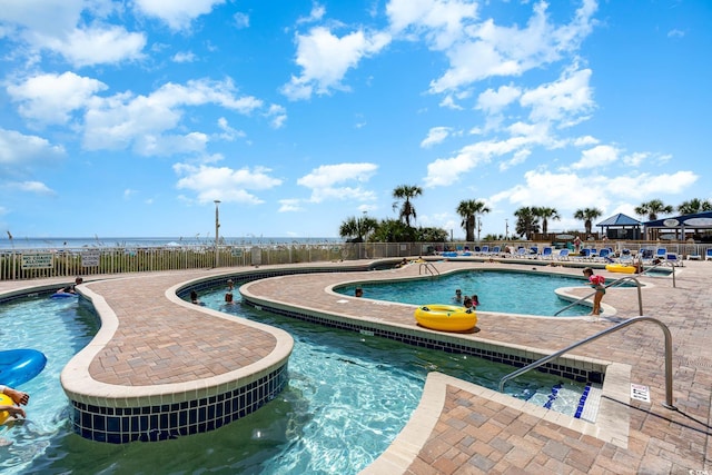 view of pool with a water view