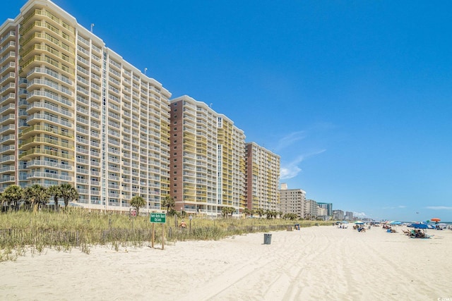 view of building exterior with a view of the beach