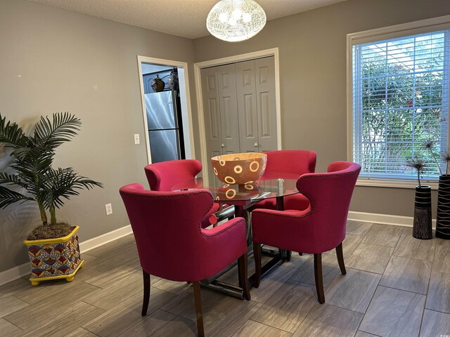 kitchen with kitchen peninsula, sink, decorative backsplash, and appliances with stainless steel finishes