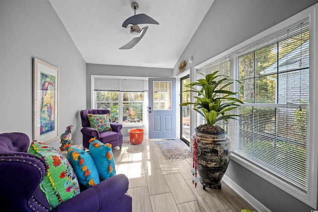 interior space with light hardwood / wood-style floors, a textured ceiling, and vaulted ceiling