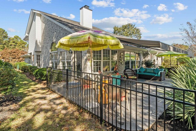 back of property with a patio area