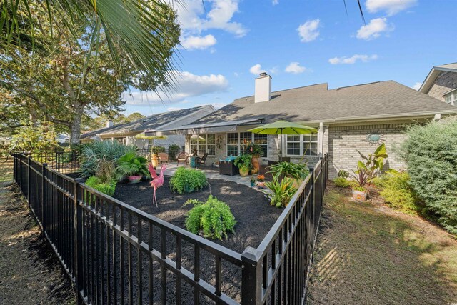 back of property featuring a patio area