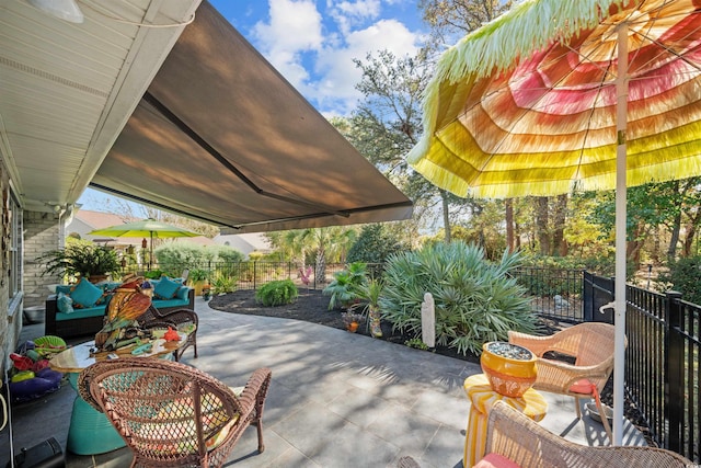 view of patio / terrace with fence and an outdoor living space