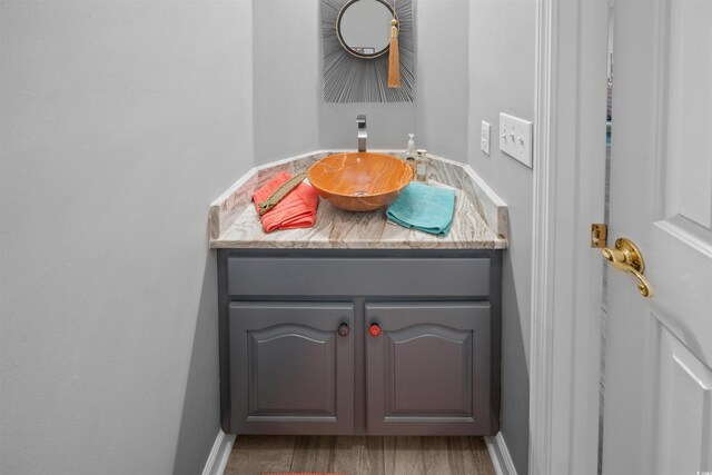 bathroom featuring hardwood / wood-style floors and vanity