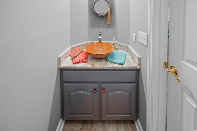 bathroom featuring vanity and baseboards