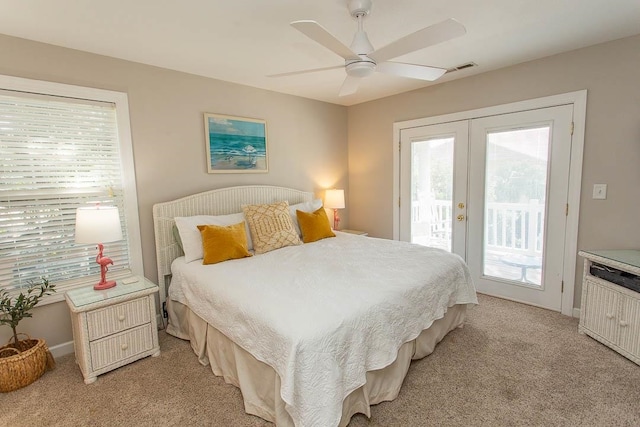 carpeted bedroom with french doors, ceiling fan, and access to exterior