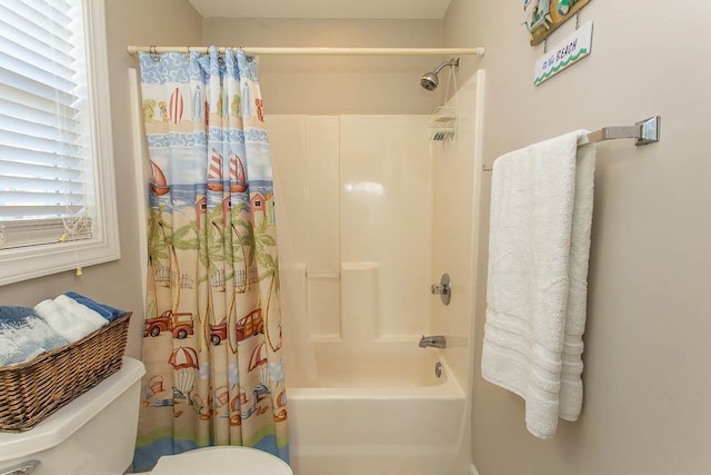 bathroom with toilet and shower / bath combination with curtain