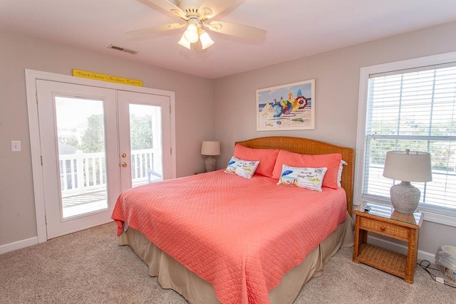 carpeted bedroom featuring french doors, ceiling fan, and access to exterior