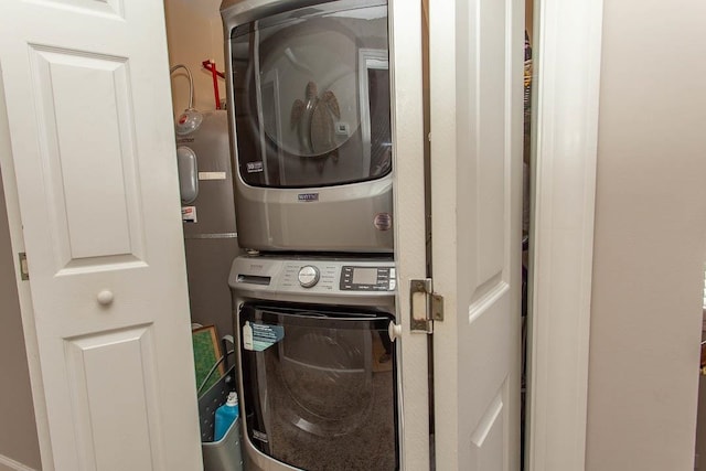 washroom featuring stacked washer and dryer