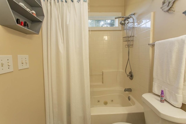 bathroom with shower / tub combo with curtain and toilet