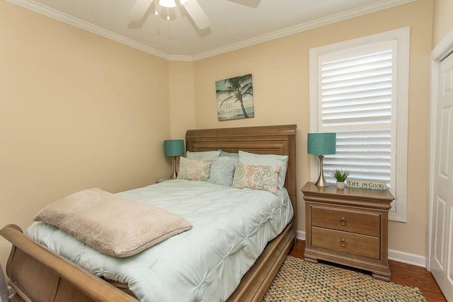 bedroom featuring hardwood / wood-style flooring, ceiling fan, and crown molding