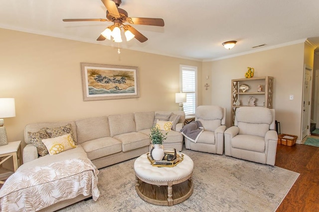 living room featuring ceiling fan, dark hardwood / wood-style floors, and crown molding