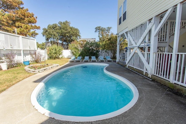 view of swimming pool featuring a patio area